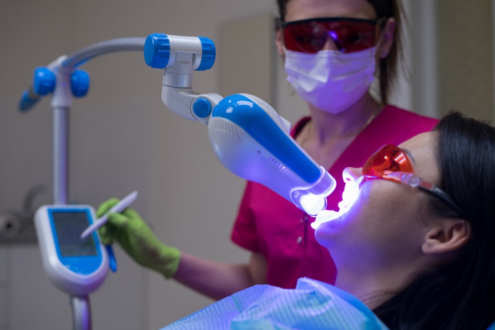 Light activation of teeth whitening gel during an in-office teeth whitening procedure